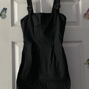 Little black dress with white stripes. Body fitting